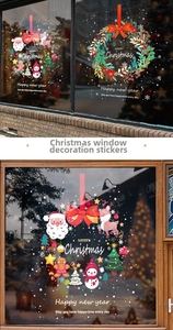 Close-up of static Christmas window decals featuring Santa, reindeer and snowman graphics