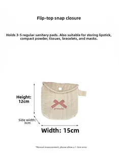 Detail view of 15x12x3cm quilted makeup pouch with graceful embroidery and bow knot