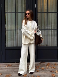 Elegant two-piece cream knit set with round neck cardigan and wide-leg trousers