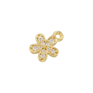 Detailed view of a gold-plated flower pendant with sparkling cubic zirconia inlay