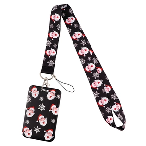 Detail of Christmas lanyard and card holder set with Santa Claus and snowflake pattern