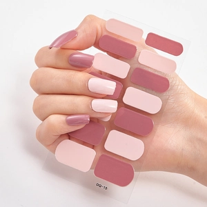 Macro view of DQ-15 3D laser gold nail stickers with pink and dark pink patterns