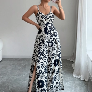 Elegant black and white floral print jumpsuit with spaghetti straps and side slits