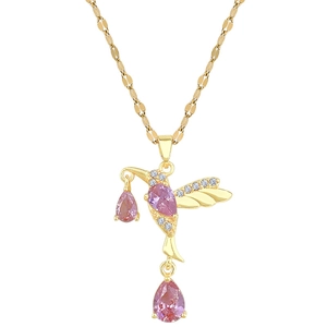 Elegant gold hummingbird necklace with pink teardrop gemstones and sparkling white crystals