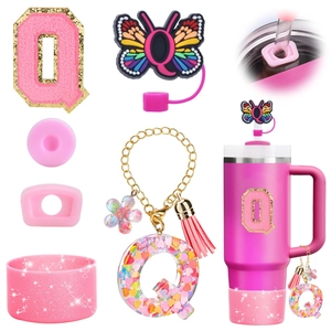 Detail of pink resin butterfly straw cap and letter Q tassel charm for tumbler decoration