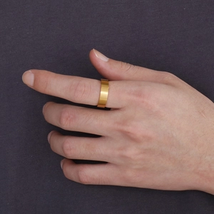 Polished 6mm gold titanium steel ring for couples worn on index finger in minimalist style