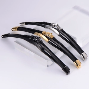 Detailed view of multilayer leather bracelet with stainless steel anchor charm on acrylic stand