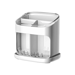 White wall-mounted kitchen organizer for utensils with transparent drainage compartments