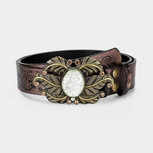 Detail of vintage brown leather belt with ornate bronze butterfly buckle and gemstones