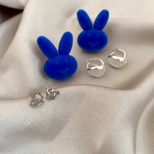 Acrylic flower petal tassel earring set with silver hearts and blue flocked bunnies