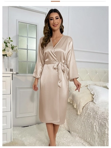 Detail showing smooth champagne satin texture and waist tie on long-sleeved bathrobe