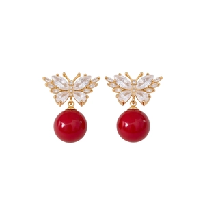Elegant gold butterfly earrings with sparkling zircon crystals and red pearl drops