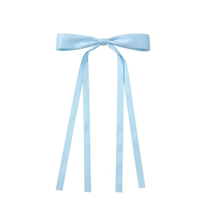 Detail of light blue satin hair bow with long streaming ribbons on a clean white background