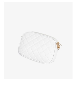 Detailed view of white quilted PU leather texture and gold metal zipper on a camera bag