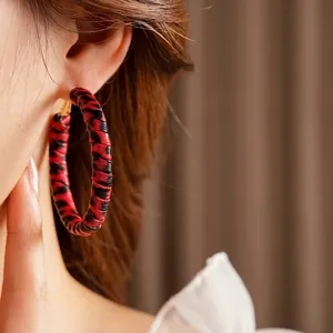 Statement leopard print round hoop earrings with premium textured leather finish