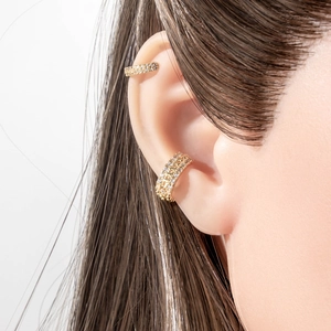 Minimalist gold U-shaped ear cuffs with micro-pave cubic zirconia on female model