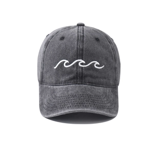 Close-up of vintage washed denim baseball cap with white wave embroidery details