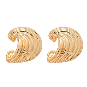 Fashionable gold C-shaped metal earrings with irregular spiral wave texture on white background