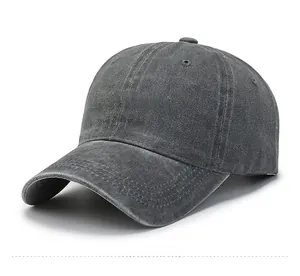 Detail view of washed cotton baseball cap featuring happy-headache embroidery text