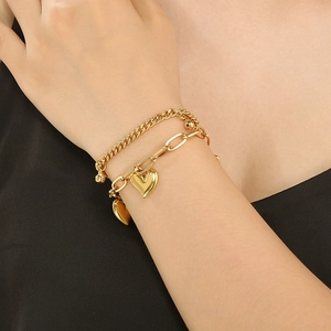 Double-layered 18K gold-plated titanium steel bracelet featuring a 3D heart pendant