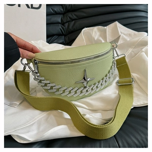 Macro shot of green lychee leather bag with silver star metal and rhinestone chain