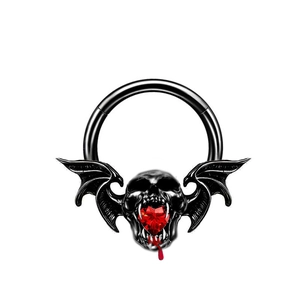 Gothic nose ring with black bat wings, skull motif and a faceted red heart gemstone