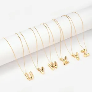 Detail of 3D gold balloon letter pendants U to Z on slim stainless steel chains