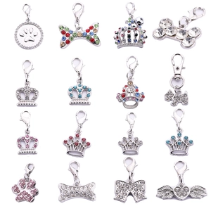 Set of 16 rhinestone pet collar charms featuring crowns and bones with lobster clasps