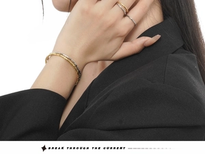 Close-up of S925 sterling silver bracelets and rings with irregular hammered texture