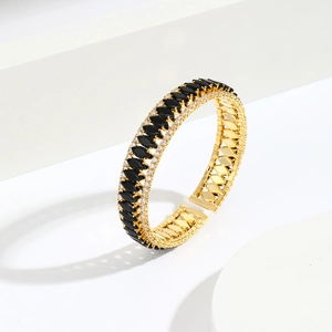 Luxurious gold open bangle featuring black marquise stones and clear micro-pave crystals
