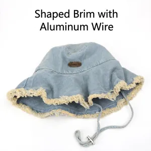 Denim bucket hat with shapeable wire brim, frayed edges and adjustable wind rope