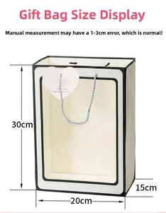 Detailed size chart for the black and white gift bag with transparent window and heart tag