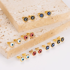 Evil Eye stainless steel stud earrings in gold with colorful resin charms on stone stands