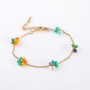 Detail of bohemian glass bead flower bracelet with golden stainless steel adjustable chain