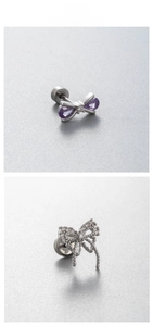 Detail of titanium steel bow earrings with purple teardrop stones and zircon inlay