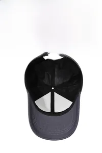Detail view of the breathable mesh lining and adjustable metal buckle on men's baseball cap