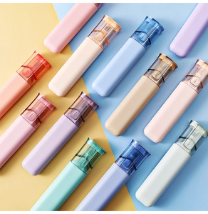 Close-up of portable toothbrush cases in various colors on a yellow and blue background