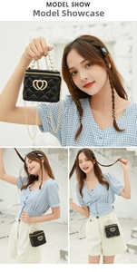 Close-up of black quilted mini bag with pearl handle and golden heart metal buckle detail