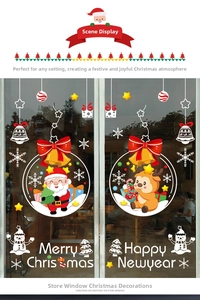 Detail of colorful Christmas static window clings featuring Santa, reindeer and snowman
