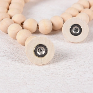 Nordic wood bead curtain tieback with magnetic buckle on beige fabric background