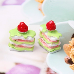 Macro detail of miniature resin strawberry napoleon cake for DIY dessert decor