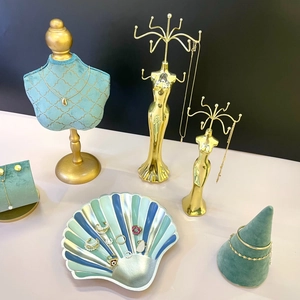 Elegant gold metal jewelry display stand set with green velvet necklace bust and shell tray