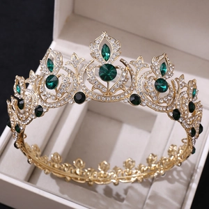 Detail of luxury bridal crown with emerald crystals and rhinestones in a beige box
