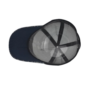 Detail view of trucker hat mesh back and interior lining with 100% acrylic care label