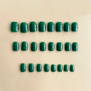 24pcs short square round glossy dark green press-on nails set laid out in a grid pattern