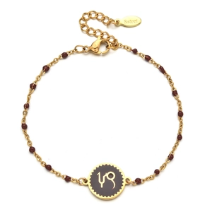 Detail of gold stainless steel beaded bracelet with red agate and Capricorn zodiac charm