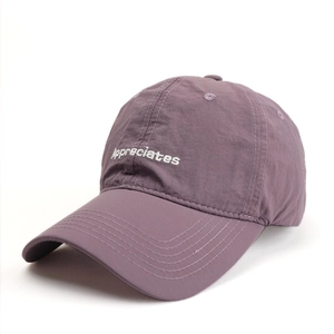 Close-up of lavender baseball cap with white Appreciates embroidery and crinkle texture