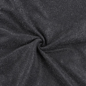 Detail of elegant black shimmering fabric with silver glitter and soft pleated texture