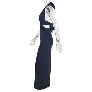 Detail of navy blue ruched side seam on bodycon halter dress with stretchy fabric texture