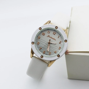 Modern white and gold women's watch with wavy textured dial and leather strap